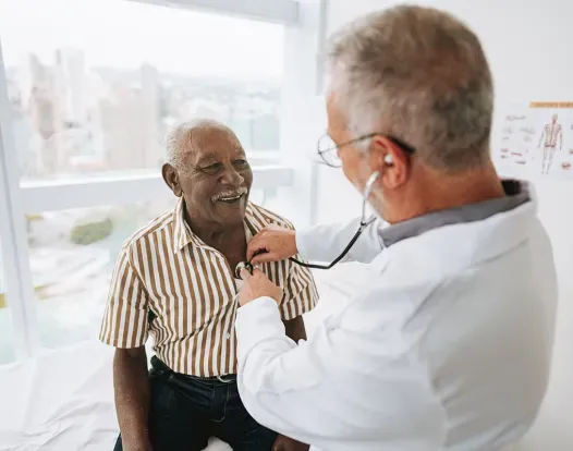 Male patient with doctor in exam room