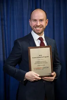 Dr. Brian Miller receiving an endowed Dr. Jane C. Wright YIA at Annual Meeting