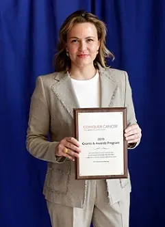 Dr. Judith Michels receiving an endowed Dr. Jane C. Wright YIA at Annual Meeting